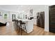 Open-concept kitchen with a central island, stainless steel appliances, ample cabinet space, and hardwood floors at 3360 Meadow Grass Dr, Dacula, GA 30019