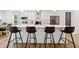Modern kitchen features a large island with seating, stainless steel appliances, and sleek countertops at 3360 Meadow Grass Dr, Dacula, GA 30019