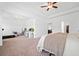 Main bedroom offering flexible space for an office, gym, and relaxation with carpeted floors at 3360 Meadow Grass Dr, Dacula, GA 30019