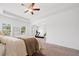 Spacious main bedroom with carpet, a ceiling fan, multiple windows, and an additional area at 3360 Meadow Grass Dr, Dacula, GA 30019