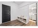 Mudroom with built-in storage, a bench seat, and access to a half-bathroom at 3360 Meadow Grass Dr, Dacula, GA 30019