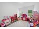 Spacious playroom featuring hardwood floors, bright natural light, and plenty of toys at 3360 Meadow Grass Dr, Dacula, GA 30019