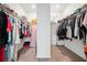 Walk-in closet with ample space to hang clothes and store other items at 3360 Meadow Grass Dr, Dacula, GA 30019