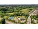 Aerial view showcasing community amenities: pool, tennis courts, and playground at 6110 Read Rd, Suwanee, GA 30024