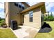 View of home's exterior, back patio and small landscaped area at 6110 Read Rd, Suwanee, GA 30024