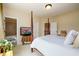 Bright bedroom with four-poster bed, ensuite bath and sitting area, providing space to relax at 6110 Read Rd, Suwanee, GA 30024