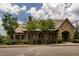 Charming community clubhouse with stone accents and manicured landscaping at 6110 Read Rd, Suwanee, GA 30024