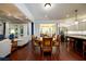 Open-concept living and dining area with hardwood floors, natural light, and kitchen access at 6110 Read Rd, Suwanee, GA 30024