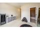 Hallway leads to the exercise room that features large mirrors, storage, and exercise equipment at 6110 Read Rd, Suwanee, GA 30024
