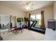 Bright exercise room features large mirrors, a ceiling fan, and exercise equipment at 6110 Read Rd, Suwanee, GA 30024