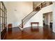 Spacious foyer boasts hardwood floors, staircase, and elegant decor at 6110 Read Rd, Suwanee, GA 30024