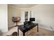Bright home office featuring a dark desk and neutral colored walls at 6110 Read Rd, Suwanee, GA 30024