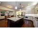 Spacious kitchen boasts granite countertops, a center island with seating, and modern stainless appliances at 6110 Read Rd, Suwanee, GA 30024