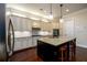 Stylish kitchen with granite countertops, stainless steel appliances, and a large island at 6110 Read Rd, Suwanee, GA 30024