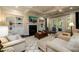 Bright living room with coffered ceilings, built-in bookshelves, and fireplace at 6110 Read Rd, Suwanee, GA 30024