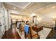 Inviting living room with coffered ceilings, hardwood floors, and an open layout to the kitchen at 6110 Read Rd, Suwanee, GA 30024