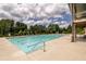 Community pool featuring lounge chairs and a beautiful clubhouse at 6110 Read Rd, Suwanee, GA 30024