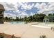 Community pool featuring lounge chairs and splash fountain for  at 6110 Read Rd, Suwanee, GA 30024