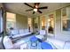 Relaxing sunroom with neutral furniture, ceiling fan, and view of the exterior at 6110 Read Rd, Suwanee, GA 30024