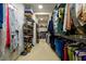 Large walk-in closet featuring an abundance of hanging storage, shelving and shoe storage at 6110 Read Rd, Suwanee, GA 30024