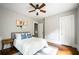 Bedroom featuring a ceiling fan, natural light, stylish décor, and a wood floor at 23 Clifton Se St, Atlanta, GA 30317