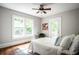 Bright bedroom with stylish decor, ceiling fan, and many sources of natural light at 23 Clifton Se St, Atlanta, GA 30317