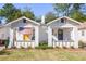 Charming exterior of a white brick home with a well-manicured front yard at 23 Clifton Se St, Atlanta, GA 30317