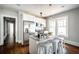 Bright kitchen featuring stainless steel appliances, granite counters, and a kitchen island with bar stool seating at 23 Clifton Se St, Atlanta, GA 30317
