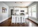 Bright kitchen featuring an island with bar stools and stainless steel appliances at 23 Clifton Se St, Atlanta, GA 30317