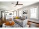 Open-concept living area with a view of the modern kitchen and bright natural light at 23 Clifton Se St, Atlanta, GA 30317