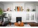 Living room with white brick fireplace, hardwood floors and modern decor at 23 Clifton Se St, Atlanta, GA 30317