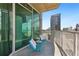 Cozy balcony space with seating and expansive city views at 361 17Th Nw St # 1603, Atlanta, GA 30363