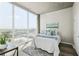Bright bedroom with city view, featuring a large window, sleek flooring, and stylish decor for a serene atmosphere at 361 17Th Nw St # 1603, Atlanta, GA 30363