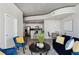 Cozy living room with modern furniture, open to the kitchen with breakfast bar, creating an inviting living space at 361 17Th Nw St # 1603, Atlanta, GA 30363