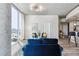Modern living room with floor-to-ceiling windows and open floorplan showcasing the kitchen at 361 17Th Nw St # 1603, Atlanta, GA 30363