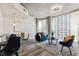 Bright living room with floor-to-ceiling windows and open layout to dining area and kitchen at 361 17Th Nw St # 1603, Atlanta, GA 30363