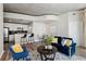 Open-concept living space with modern furniture and finishes; kitchen in background at 361 17Th Nw St # 1603, Atlanta, GA 30363