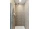 Modern walk-in shower with tiled walls and sleek fixtures, creating a spa-like experience for relaxation and comfort at 361 17Th Nw St # 1603, Atlanta, GA 30363