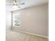 Bright bedroom with carpet, fan, and a window with blinds offering natural light at 4087 Kingsley Park Ct, Peachtree Corners, GA 30096