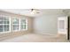 Bedroom with three large windows providing plenty of natural light at 4087 Kingsley Park Ct, Peachtree Corners, GA 30096