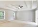 Spacious main bedroom boasts tray ceilings and natural light from the large windows at 4087 Kingsley Park Ct, Peachtree Corners, GA 30096