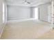 Open main bedroom featuring a tray ceiling, ceiling fan, and neutral paint at 4087 Kingsley Park Ct, Peachtree Corners, GA 30096