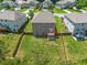 An aerial view of the home and backyard showing the lawn and deck at 6660 Country Lake Rd, Cumming, GA 30041