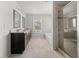 Elegant bathroom boasts double vanities, a soaking tub, and a tiled glass shower at 6660 Country Lake Rd, Cumming, GA 30041