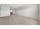 Bright, neutral hallway with light carpet and natural light at 6660 Country Lake Rd, Cumming, GA 30041