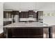 Modern kitchen featuring a large island, stainless steel appliances, and ample cabinet space at 6660 Country Lake Rd, Cumming, GA 30041