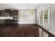 Well-appointed kitchen with stainless steel appliances, sleek cabinetry, and access to the backyard at 6660 Country Lake Rd, Cumming, GA 30041