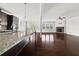 Gourmet kitchen with granite countertops, stainless steel appliances, and a central island at 6660 Country Lake Rd, Cumming, GA 30041