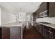Stylish kitchen with stainless steel appliances, granite countertops, and hardwood flooring at 6660 Country Lake Rd, Cumming, GA 30041
