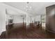 Spacious living area showcasing hardwood floors and an open layout to the modern kitchen at 6660 Country Lake Rd, Cumming, GA 30041